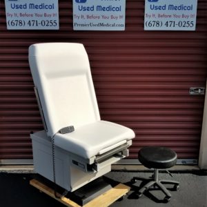 UMF 5060 w New White Upholstery (dent in corner)   400 lb capacity  Power Base and Back w Hand Control
