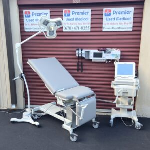 Exam Tables for Sale MPI Model 8087 with New Graphite Upholstery and Stir ups Power Up and Tilt